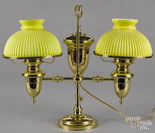 Brass double student lamp, late 19th c., with ribbed yellow shades, 21'' h.