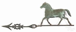 Swell-bodied copper horse weathervane, 19th c., with a cast iron directional arrow, 20 1/4'' l.