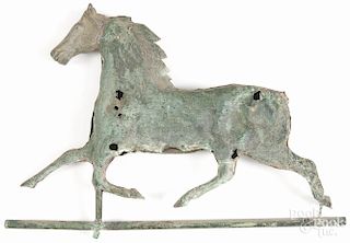 Swell-bodied copper horse weathervane, 19th c., with a cast iron head and a verdigris surface