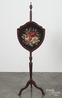 Mahogany pole screen, early 20th c., with a floral needlework panel, 58'' h.