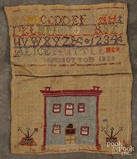 Needlework sampler, inscribed Alice Nuttle her work 1823, with a house flanked by potted flowers