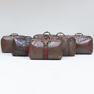 Group of Six Gucci Leather Soft Sided Suitcases