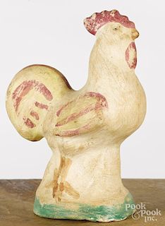 Two pieces of chalkware, 19th c., to include a fruit basket with a wire handle, 6'' h., and a rooster