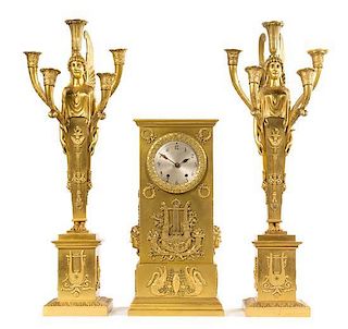 An Empire Style Gilt Bronze Clock Garniture Height of clock 18 inches.