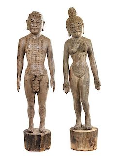 A Pair of Chinese Carved Wood Acupuncture Models Height of tallest 59 inches.
