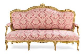 * A Louis XV Style Giltwood Sofa Height 47 x width 76 x depth 24 1/2 inches.