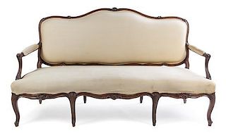 * A Louis XV Style Walnut Canape Height 40 3/4 x width 70 1/4 x depth 25 inches.