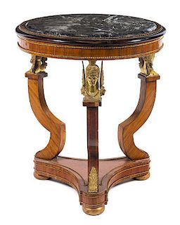 An Empire Style Gilt Bronze Mounted Kingwood Gueridon Height 30 1/2 x diameter of top 25 1/2 inches.