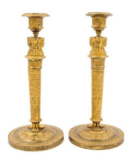 A Pair of Empire Gilt Bronze Candlesticks Height 10 3/4 inches.