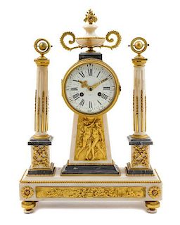 An Empire Gilt Bronze Mounted Marble Mantel Clock Height 19 1/2 inches x width 13 3/4 x depth 4 inches.