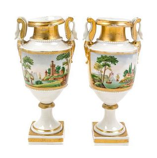 A Pair of Paris Porcelain Urns Height of each 10 1/2 inches.