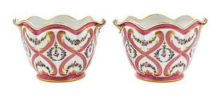 A Pair of Sevres Porcelain Cache Pots Height 6 1/2 x width over handles 10 1/4 inches.