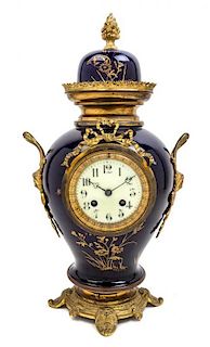 A Gilt Bronze Mounted Sevres Style Porcelain Mantle Clock Height 19 inches.