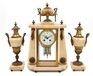 A French Onyx and Gilt Bronze Clock Garniture Height of clock 18 inches.