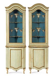 A Pair of Italian Painted Corner Cabinets Height 81 1/2 x width 23 1/2 x depth 18 1/2 inches.