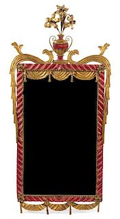 An Italian Tole Mirror Height 53 1/2 x width 25 3/4 inches.