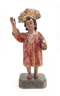 A Carved Wood Santos Figure Height 17 3/4 inches.