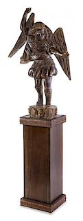 A Continental Carved Wood Figure of Saint Michael Height of figure 51 1/2 inches; height overall 95 3/8 inches.