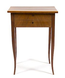 A Biedermeier Birch and Mahogany Side Table Height 30 1/4 x width 21 3/4 x depth 15 inches.