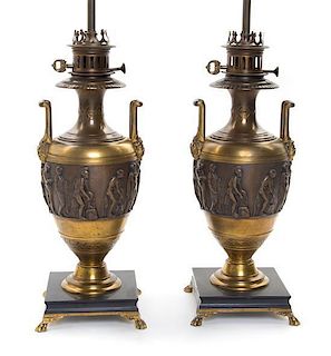 A Pair of Neoclassical Gilt and Patinated Bronze Urns Height 32 inches.