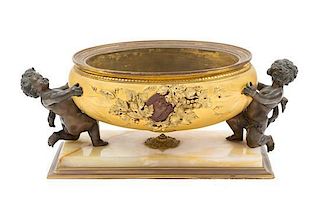 * A Continental Gilt and Patinated Bronze and Onyx Jardiniere Height 5 7/8 x width 14 1/2 inches.
