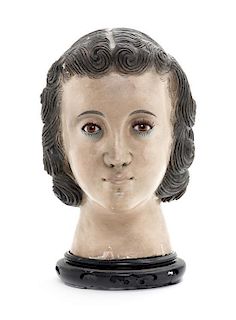A Continental Carved and Polychrome Decorated Bust Height 9 1/2 inches.