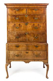 A George I Feather Banded Walnut Chest on Stand Height 69 x width 41 1/4 x depth 22 1/4 inches.