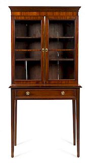 A Regency Mahogany Cabinet on Stand Height 64 1/2 x width 32 x depth 14 3/4 inches.