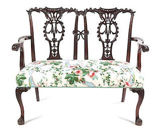 * A Chippendale Style Mahogany Double Back Settee Height 36 1/2 x width 45 1/2 x depth 21 inches.