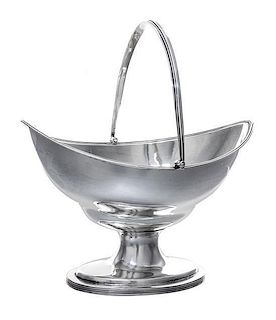 A George III Silver Sugar Basket, Hester Bateman, London, 1790, of oblong form with a reeded edge and a swing handle, raised on