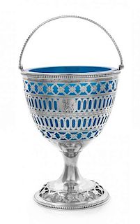 A George III Reticulated Silver Sugar Basket with Glass Liner, Hester Bateman, London, 1783, of ovoid form, having a beaded edge