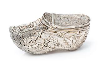 A German Silver Vinaigrette, Maker's Mark Obscured, in the form of a shoe, the exterior chased with floral, foliate and fauna de