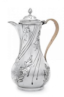 A George II Silver Coffee Pot, Thomas Whipham & Chas. Wright London, 1757, of twisted baluster form, the body worked with floral