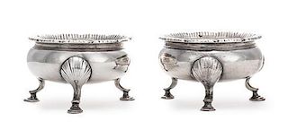 A Pair of George III Silver Salt Cellars, Stephen Adams II, London, 1767, each raised on three feet headed by shells.