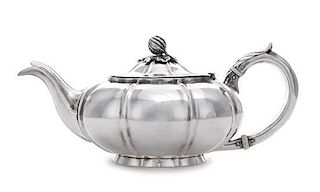 A William IV Bachelor's Teapot, Charles Gordon, London, 1832, having a gourd and foliate finial surmounting a ribbed lid and bod