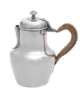 A French Silver Creamer, Maker's Mark Obscured, having a woven wicker handle, the body with engraved monogram GM.