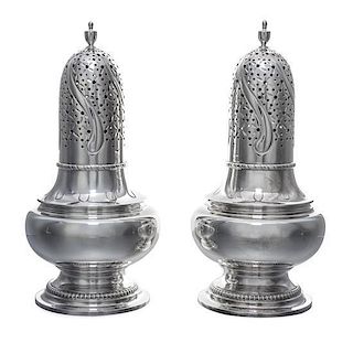 A Pair of American Silver Muffineers, Tiffany & Co., New York, NY, each of baluster form with an urn finial.
