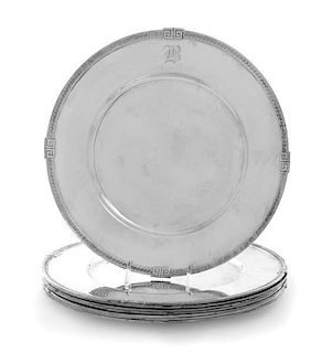 A Set of Seven American Silver Dinner Plates, Gorham Mfg. Co., Providence, RI, each having a Greek key decorated border.