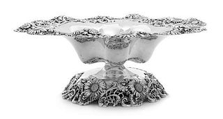 An American Silver Tazza, Dominick & Haff, New York, NY, the bowl and foot rim decorated with floral and pierced C-scroll decora