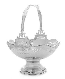 An American Silver Fruit Basket, Maker's Mark Obscured, of ovoid form, both the handle and body worked to show floral spray and
