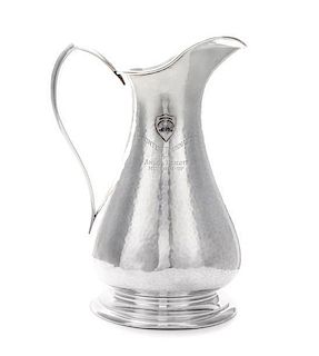 * An American Silver Pitcher, Sedlacek & Co., Los Angeles, CA, 1945, of baluster form with a pointed loop handle, the spot-hamme