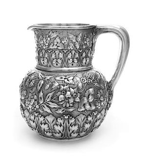 An American Silver Water Pitcher, Bigelow, Kennard & Co., Boston, MA, having a rounded body with a cylindrical neck, with floral