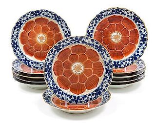 * A Set of Twelve Chinese Blue, White and Iron Red Porcelain Dishes Diameter 8 inches.