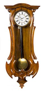 * An American Simulated Rosewood Wall Clock Length of case 38 1/2 inches.