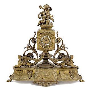 An Aesthetic Movement Gilt Metal Mantel Clock Height 16 inches.