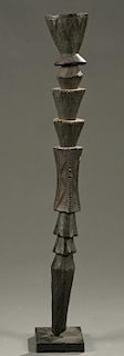 West African staff with geometric carvings.