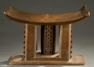 Asante stool with curved seat, 20th century.