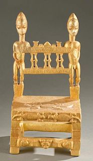 Baule gold leaf chair with male figures.