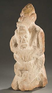 Dogon style kneeling stone maternity figure.