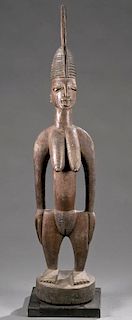 Yoruba standing female shrine figure, early 20th c